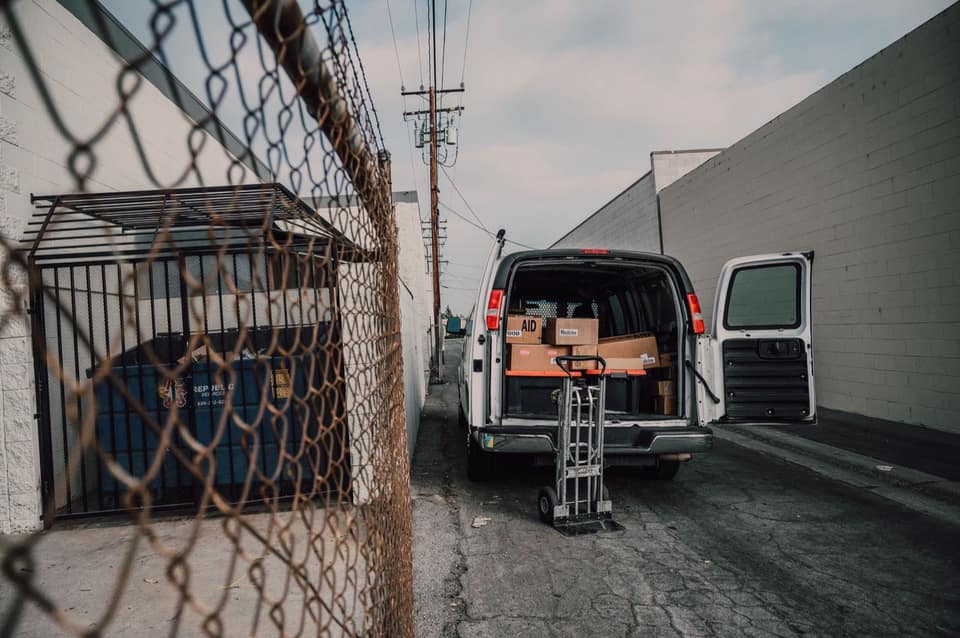 A delivery van loaded with boxes for a standing order run